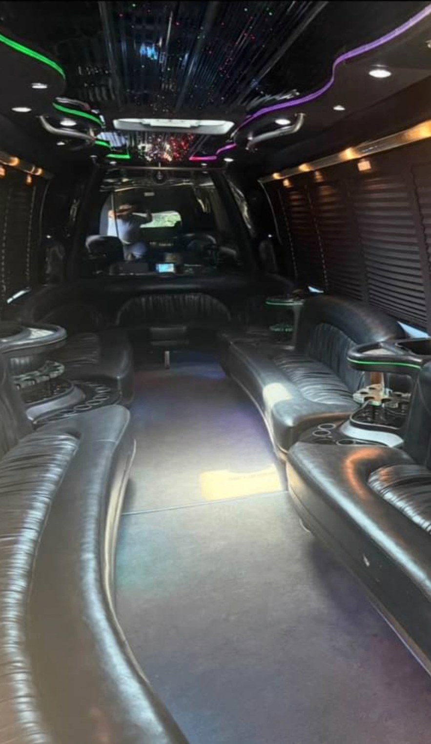 Limo bus interior with leather seating, bars and LED lighting